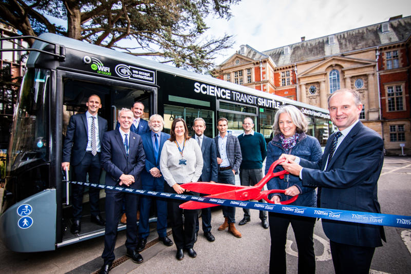 Photo of ribbon-cutting ceremony at the entrance to the Science Area, to mark the launch of the new Science Transit Shuttle.